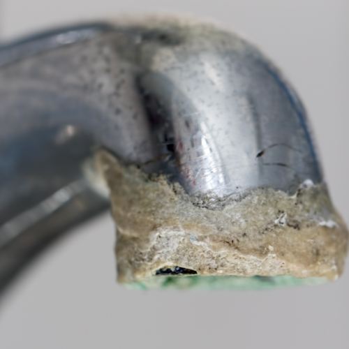 A Faucet Crusted With Calcium Deposits.